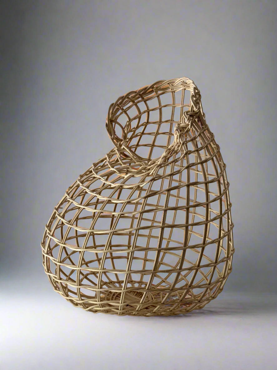 Woven basket on a plain background