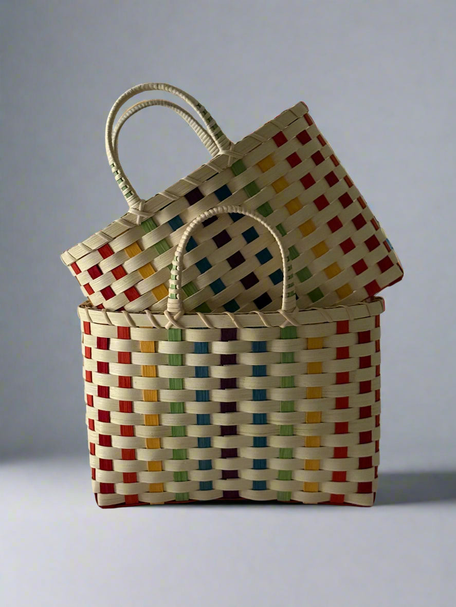 Colorful woven baskets on a plain background