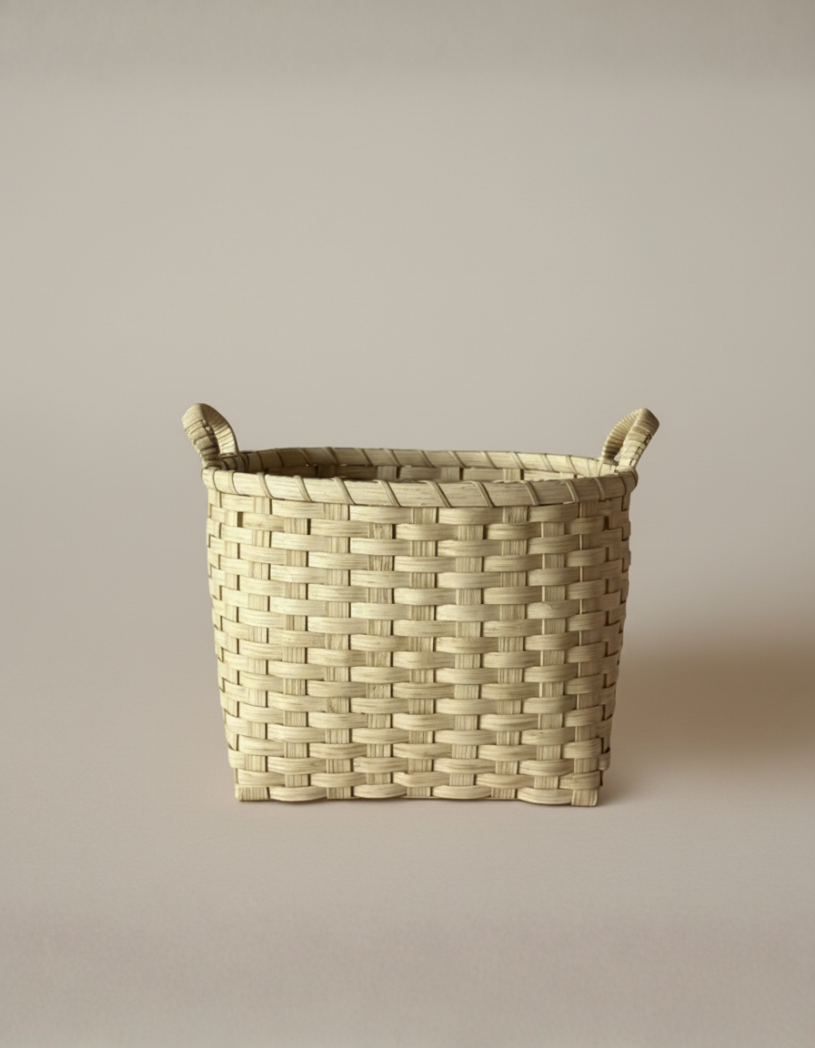 Woven basket with handles on a beige background