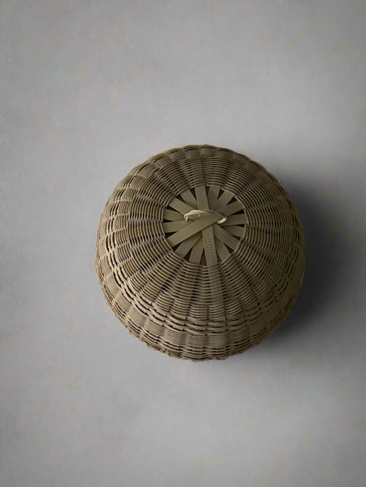 Woven basket on a plain background