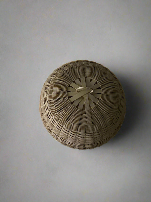 Woven basket on a plain background