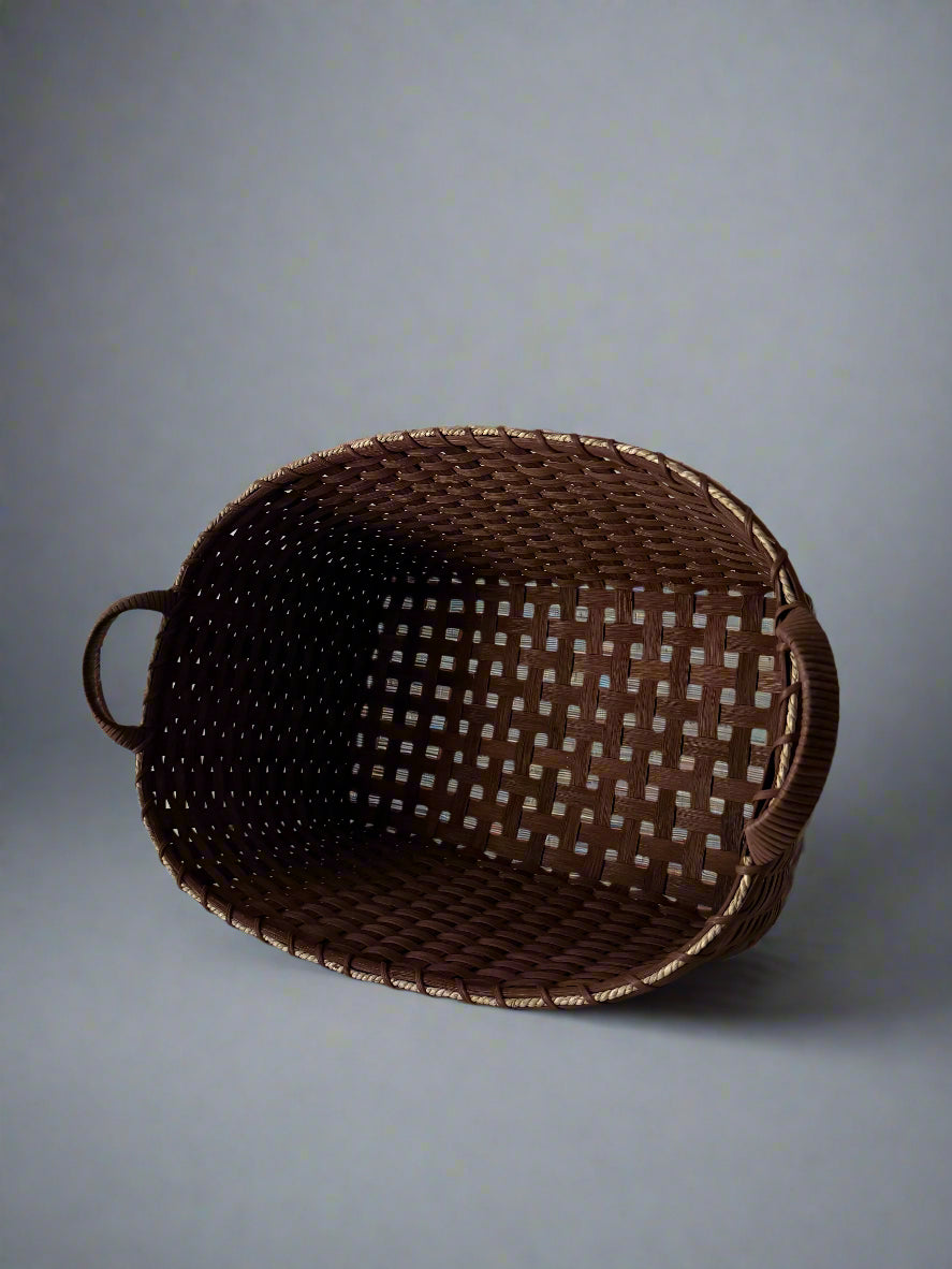 Brown woven basket on a light gray background