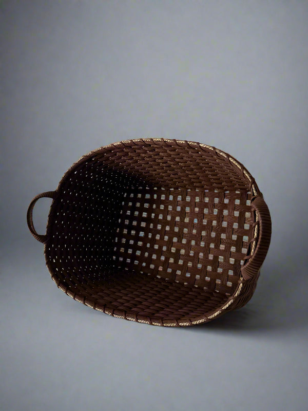 Brown woven basket on a light gray background
