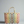 Colorful woven basket on a gray surface with a neutral background