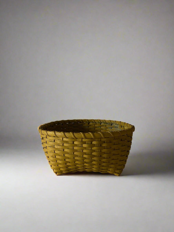 Woven basket on a plain background