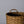 Woven basket with a handle on a light gray background
