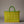 Woven basket with green top and yellow sides on a gray background