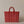 Red and white striped woven bag on a beige background