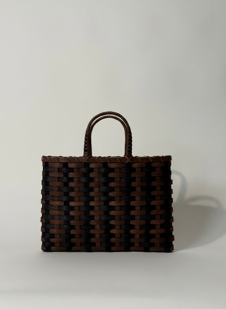 Woven brown bag on a white background
