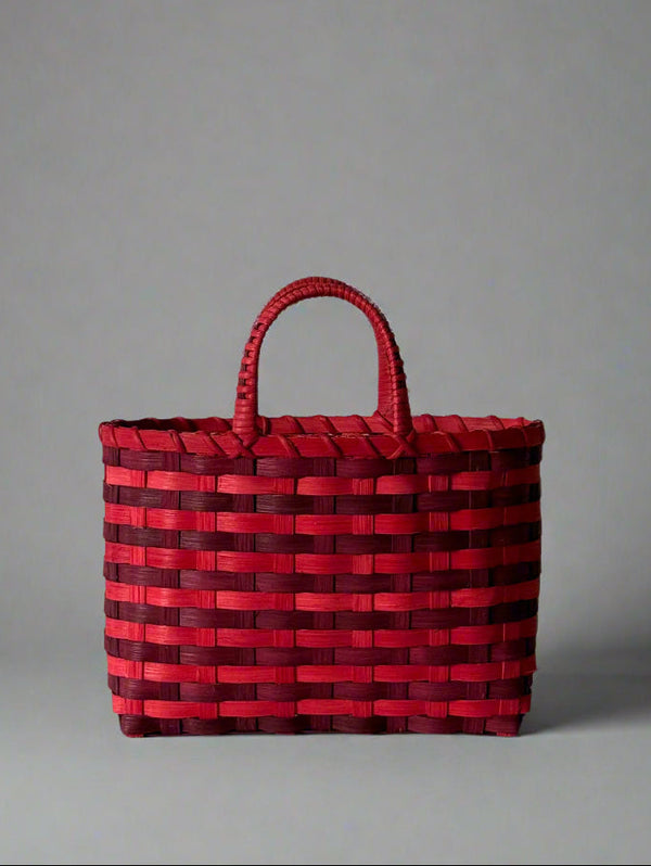 Red woven bag on a gray background
